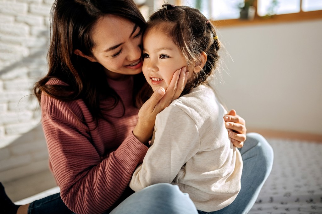 A woman holding a child